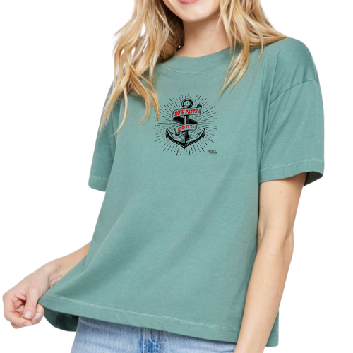 Person wearing a green t-shirt with a graphic design on a white background